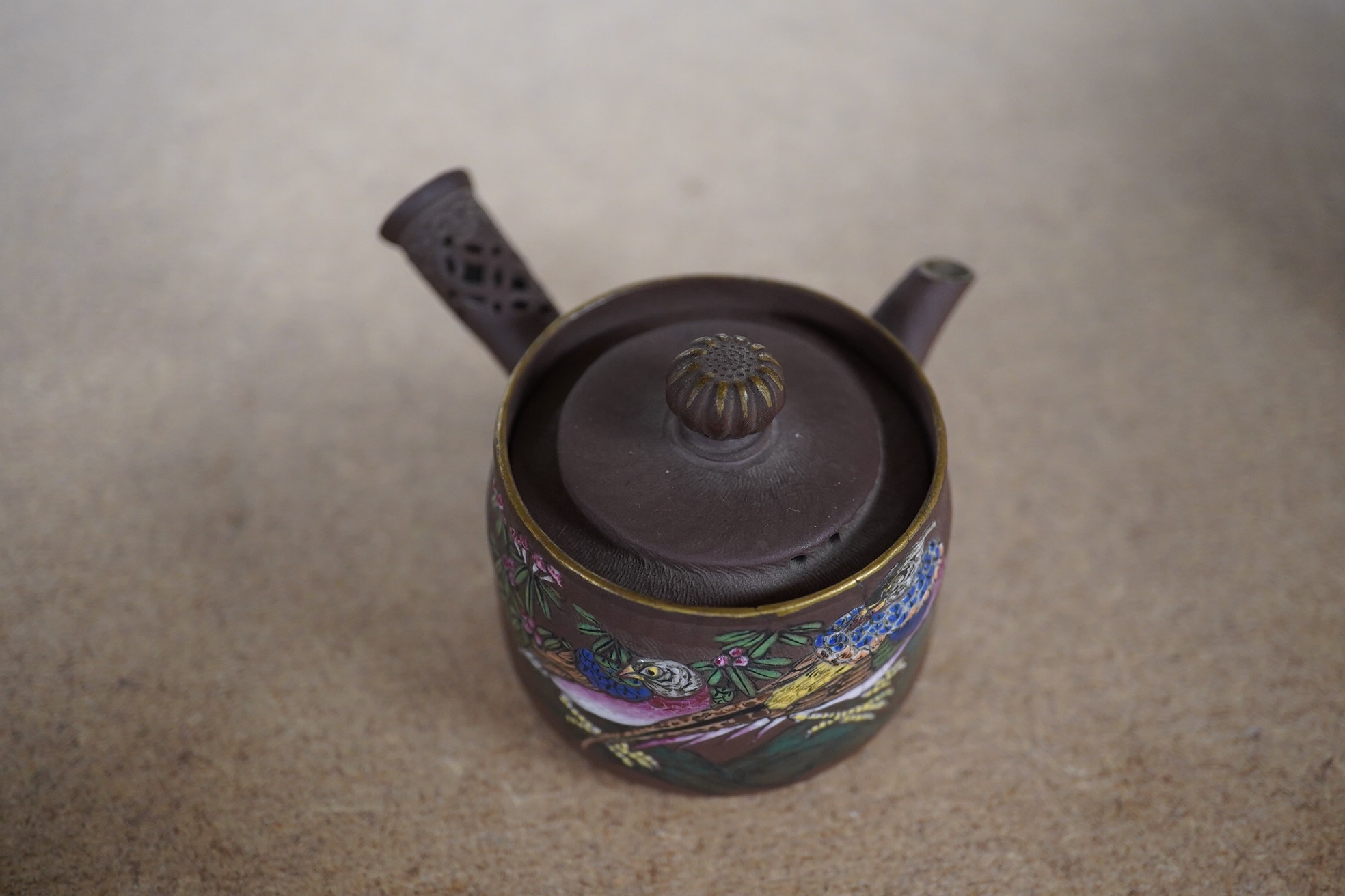 A 19th century Chinese enamelled Yixing miniature teapot, 7.5cm wide. Condition - good